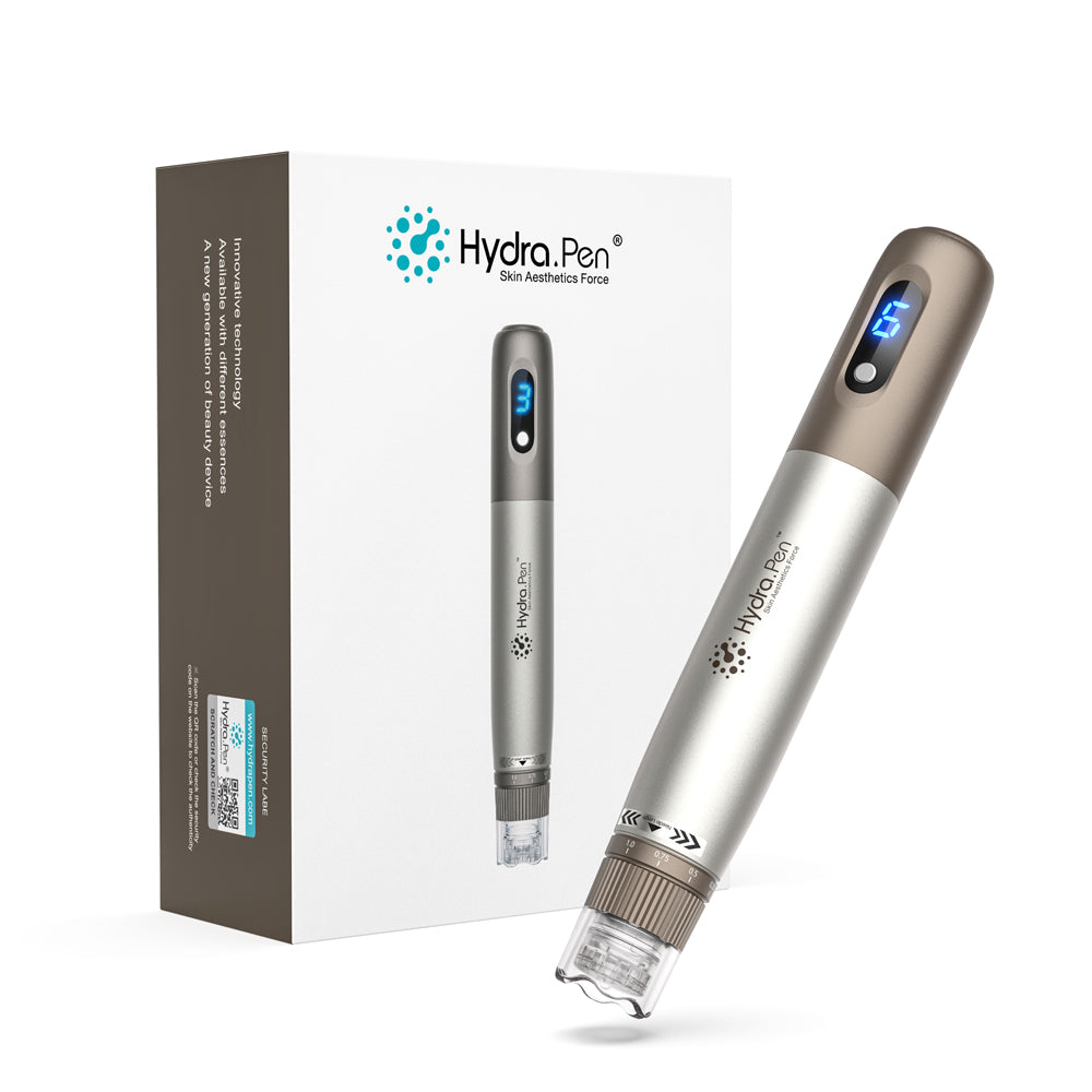 Hydra Pen H3 argenté et bronze à côté de sa boîte d’origine